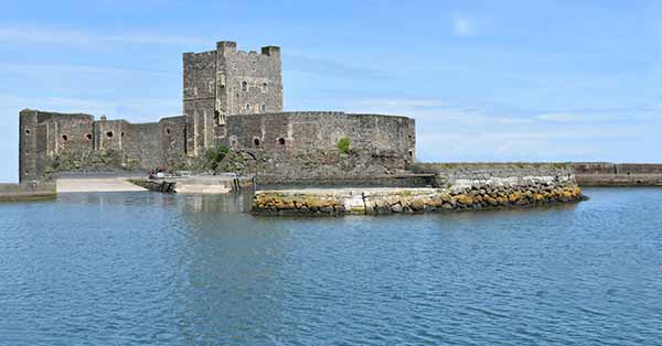 Massive stone Norman castle on an islet