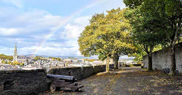 Atop Derry Walls in autumn under a rainbow