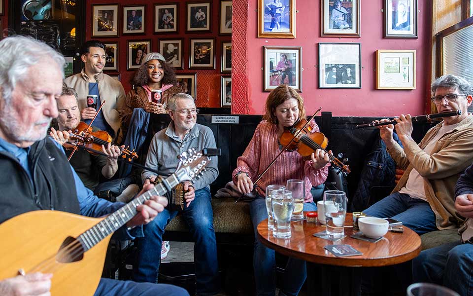 A group of musicians in a pub