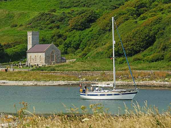 Church & boat approaching Rathlin Island